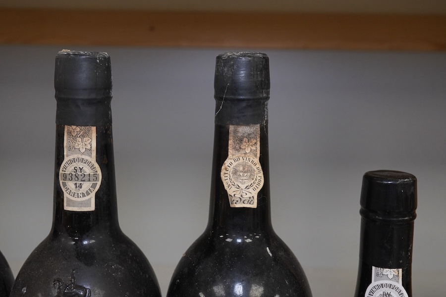 Five bottles of port to include three bottles of Warre’s 1975 (no label), a bottle of C. Da Silvas Vintage 1982 port and a 37.5cl bottle of Warres 1987 Quinta Da Cavadinha. Condition - fair to good, three bottles without